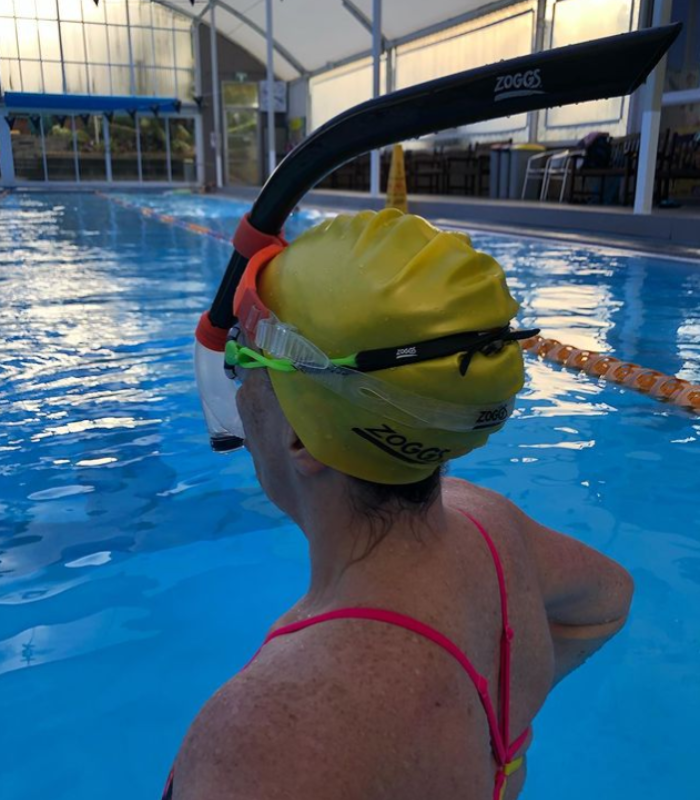 Sandy wearing a centre line snorkel in the pool 
