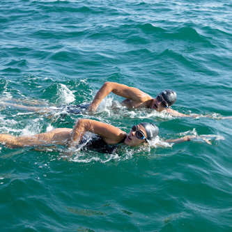 Man and woman swimming in the ocean 